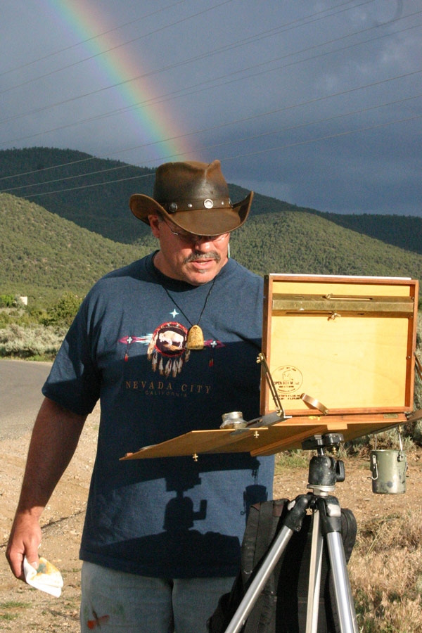 Image: Rainbow behind Rich Gallego while painting